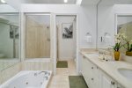 Oceanfront master ensuite with sunken spa tub, separate glass shower, toilet and bidet